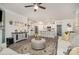 Spacious living room flows into the open kitchen with a large center island and modern appliances at 4023 Gozzi Dr, Iron Station, NC 28080