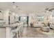 Open-concept living space seamlessly connects the kitchen, dining, and living areas, perfect for entertaining at 4023 Gozzi Dr, Iron Station, NC 28080