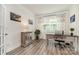 Home office with hardwood floors, neutral walls, a desk, and ample natural light at 4023 Gozzi Dr, Iron Station, NC 28080