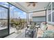 Screened-in porch boasts comfortable seating and views of the surrounding landscape at 4023 Gozzi Dr, Iron Station, NC 28080