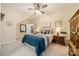 Comfortable bedroom with soft lighting, a comfortable bed, ceiling fan, and decor at 4300 Haddington Dr, Fort Mill, SC 29707