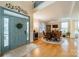 Bright foyer leads to formal dining with a decorative light fixture and hardwood floors at 4300 Haddington Dr, Fort Mill, SC 29707