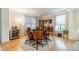 Cozy living room featuring hardwood floors, natural light, and a modern ceiling fan at 4300 Haddington Dr, Fort Mill, SC 29707