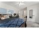 Bright bedroom featuring two whiteboards, a ceiling fan, and a double door closet at 4608 Snow Dr, Harrisburg, NC 28075