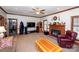 Spacious living room featuring a fireplace, ceiling fan, and recessed lighting at 5304 Woodridge Dr, Monroe, NC 28110