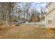 Large backyard with a picnic table, shed, and a fenced yard at 6622 Cedar Cliff Dr, Charlotte, NC 28216