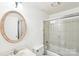 Bathroom featuring a bathtub and an oval mirror at 7344 Pebblestone Dr # E, Charlotte, NC 28212
