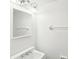 All-white bathroom showcasing a vanity, mirror, towel rack, and decorative lighting at 7344 Pebblestone Dr # E, Charlotte, NC 28212