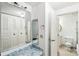 Bathroom showcasing vanity, mirrors and walk-in closet at 7344 Pebblestone Dr # E, Charlotte, NC 28212