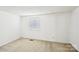 Bedroom showcasing neutral carpeting and a window at 7344 Pebblestone Dr # E, Charlotte, NC 28212