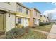 A row of charming townhouses, each with unique siding and well-maintained front yards at 7344 Pebblestone Dr # E, Charlotte, NC 28212