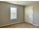 Cozy bedroom with natural light from the window and closet at 7702 Brisbane Ct, Charlotte, NC 28215