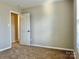 Bedroom with carpeted floors, a closet and natural light from the window at 7702 Brisbane Ct, Charlotte, NC 28215