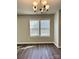 Bright dining room with hardwood floors, chandelier and windows at 7702 Brisbane Ct, Charlotte, NC 28215