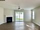 Spacious living room with fireplace and sliding doors to the backyard at 7702 Brisbane Ct, Charlotte, NC 28215