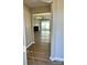 View of the living room through a doorway, featuring a fireplace and sliding glass doors at 7702 Brisbane Ct, Charlotte, NC 28215