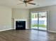Bright living room with fireplace and sliding doors to the backyard at 7702 Brisbane Ct, Charlotte, NC 28215