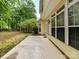 Back patio area with ample sunshine, white trim, and large windows at 7713 Dunoon Ln, Charlotte, NC 28269