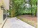 Spacious backyard with a wooded fence line at 7713 Dunoon Ln, Charlotte, NC 28269