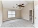 Bright, spacious carpeted bedroom with vaulted ceiling, ceiling fan, and natural light at 7713 Dunoon Ln, Charlotte, NC 28269