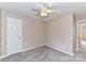 Neutral bedroom featuring carpet, neutral walls, and a closet with a white door at 7713 Dunoon Ln, Charlotte, NC 28269