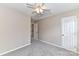 Neutral bedroom featuring carpet, neutral walls, closet and a doorway at 7713 Dunoon Ln, Charlotte, NC 28269