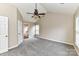 Spacious carpeted bedroom with vaulted ceiling, fan, and access to the ensuite bathroom at 7713 Dunoon Ln, Charlotte, NC 28269
