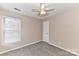 Neutral bedroom featuring carpet, neutral walls, and a window with blinds at 7713 Dunoon Ln, Charlotte, NC 28269