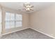 Neutral bedroom featuring carpet, neutral walls, and a window with blinds at 7713 Dunoon Ln, Charlotte, NC 28269