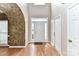 Spacious entry foyer with beautiful hardwood floors, textured walls, and ample natural light at 7713 Dunoon Ln, Charlotte, NC 28269
