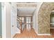 Inviting foyer with hardwood floors, staircase, and an arched entrance at 7713 Dunoon Ln, Charlotte, NC 28269