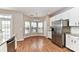 Eat-in kitchen featuring a stainless steel refrigerator and a breakfast nook with large windows at 7713 Dunoon Ln, Charlotte, NC 28269