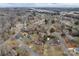 An aerial view of a residential area featuring various single-Gathering homes and streets winding through the neighborhood at 821 Cabaniss Dr, Shelby, NC 28150