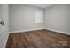 Cozy bedroom with neutral walls and hardwood floors at 821 Cabaniss Dr, Shelby, NC 28150