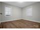 Bedroom with wood-look flooring, neutral walls, and window at 821 Cabaniss Dr, Shelby, NC 28150