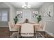 Staged dining room with a wooden table and plants on the side at 821 Cabaniss Dr, Shelby, NC 28150
