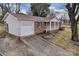 View of brick home with attached garage and concrete driveway at 821 Cabaniss Dr, Shelby, NC 28150
