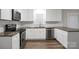 Modern kitchen with stainless steel appliances, granite countertops, and white cabinets at 821 Cabaniss Dr, Shelby, NC 28150