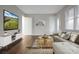 Bright living room with modern decor, hardwood floors, and a large television at 821 Cabaniss Dr, Shelby, NC 28150