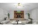 Virtually staged living room showcasing a brick fireplace and modern decor adding a touch of elegance to the comfortable space at 821 Cabaniss Dr, Shelby, NC 28150