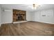 Spacious living room features a brick fireplace and hardwood floors at 821 Cabaniss Dr, Shelby, NC 28150