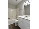 Bright bathroom featuring a shower and tub combination, modern vanity, and neutral tones at 8812 Glenover Cir, Charlotte, NC 28269