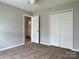Bedroom with carpeted floor, ceiling fan, and closet at 8812 Glenover Cir, Charlotte, NC 28269