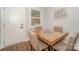 Bright dining area with a unique table and chairs and a nearby door for easy access at 921 Ambassador St # 1, Charlotte, NC 28208