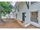 Charming townhouse featuring a white brick exterior and black trim accents at 921 Ambassador St # 1, Charlotte, NC 28208