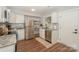 Modern kitchen featuring stainless steel appliances, granite countertops, and white cabinets at 921 Ambassador St # 1, Charlotte, NC 28208