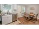 Galley kitchen with stainless steel appliances, and views to dining area at 921 Ambassador St # 1, Charlotte, NC 28208