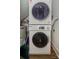 Convenient laundry area with stacked washer and dryer for efficient space utilization at 921 Ambassador St # 1, Charlotte, NC 28208