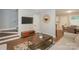 Open-concept living room with stairs, seamlessly connecting the dining area and kitchen at 921 Ambassador St # 1, Charlotte, NC 28208