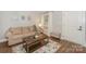 Inviting living room with a comfy couch, stylish coffee table, and plenty of natural light at 921 Ambassador St # 1, Charlotte, NC 28208
